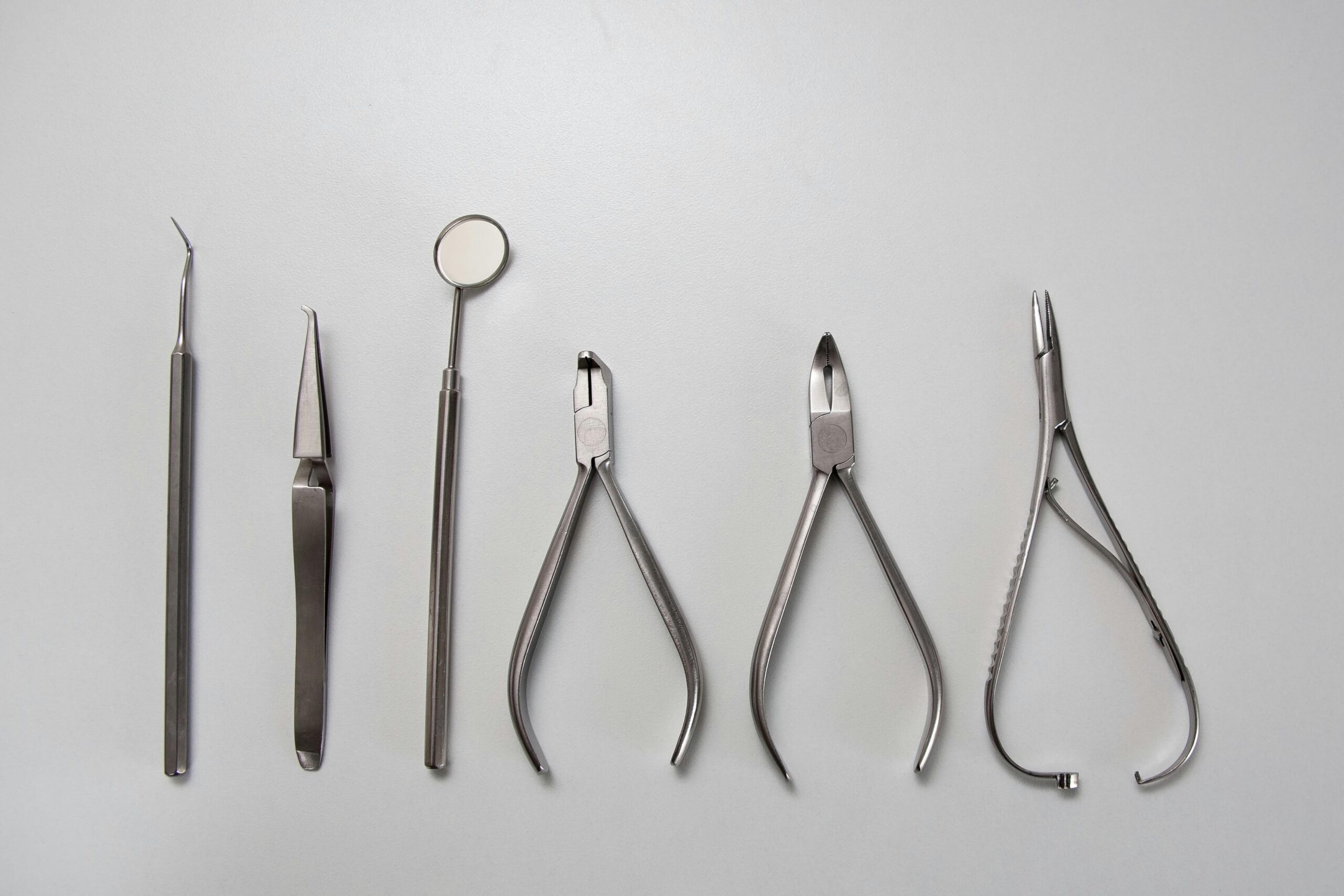 A collection of dental instruments used for oral surgery